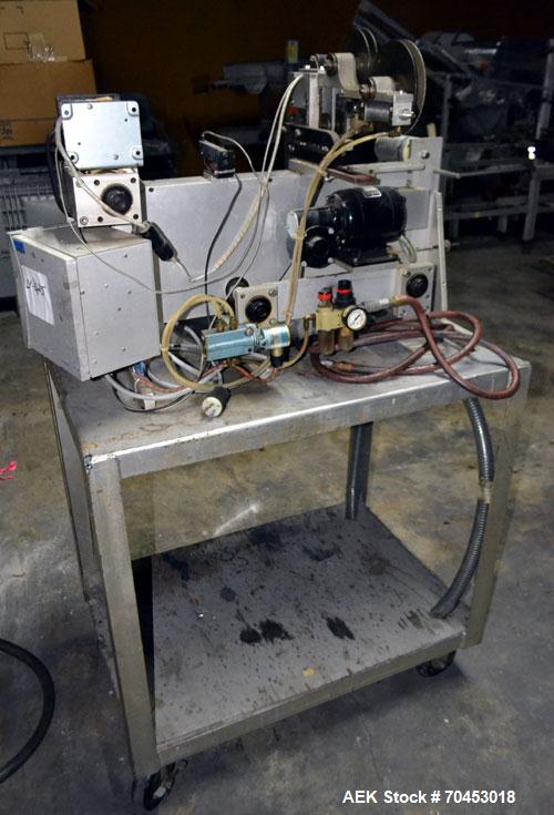 Used Norwood LIS offline stand alone label imprinting system. Capable of speeds up to 150 labels per minute. Imprint areas up to 4" x 4". Standard label reals on 3" inner coder and max 12" diam reel....