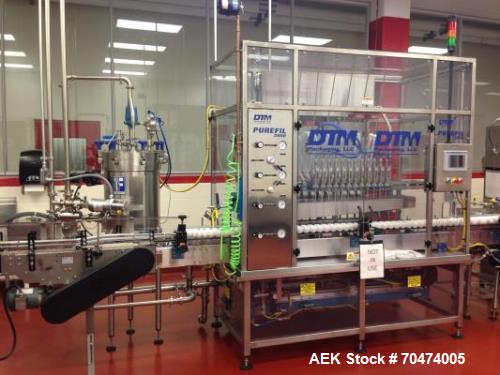 Used 2 oz. Energy Shot Bottle Filling Line. Includes: New England Model NEHCPCL bottle unscrambler with bottle elevator, capable of 250/minute. DTM Purefil 2000 12-head straightline continuous motion...