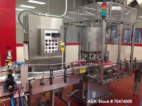 Used 2 oz. Energy Shot Bottle Filling Line. Includes: New England Model NEHCPCL bottle unscrambler with bottle elevator, capable of 250/minute. DTM Purefil 2000 12-head straightline continuous motion...