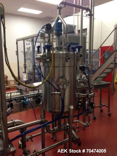 Used 2 oz. Energy Shot Bottle Filling Line. Includes: New England Model NEHCPCL bottle unscrambler with bottle elevator, capable of 250/minute. DTM Purefil 2000 12-head straightline continuous motion...