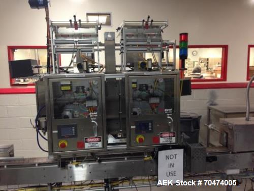 Used 2 oz. Energy Shot Bottle Filling Line. Includes: New England Model NEHCPCL bottle unscrambler with bottle elevator, capable of 250/minute. DTM Purefil 2000 12-head straightline continuous motion...