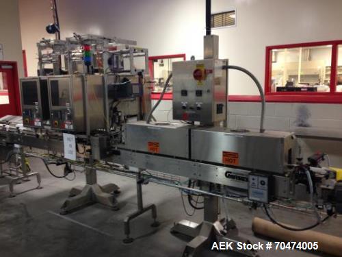Used 2 oz. Energy Shot Bottle Filling Line. Includes: New England Model NEHCPCL bottle unscrambler with bottle elevator, capable of 250/minute. DTM Purefil 2000 12-head straightline continuous motion...