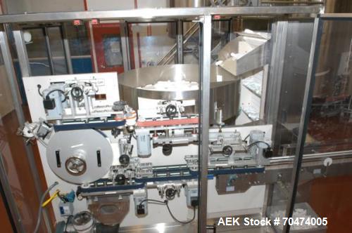 Used 2 oz. Energy Shot Bottle Filling Line. Includes: New England Model NEHCPCL bottle unscrambler with bottle elevator, capable of 250/minute. DTM Purefil 2000 12-head straightline continuous motion...
