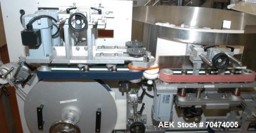 Used 2 oz. Energy Shot Bottle Filling Line. Includes: New England Model NEHCPCL bottle unscrambler with bottle elevator, capable of 250/minute. DTM Purefil 2000 12-head straightline continuous motion...