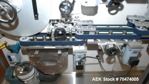 Used 2 oz. Energy Shot Bottle Filling Line. Includes: New England Model NEHCPCL bottle unscrambler with bottle elevator, capable of 250/minute. DTM Purefil 2000 12-head straightline continuous motion...