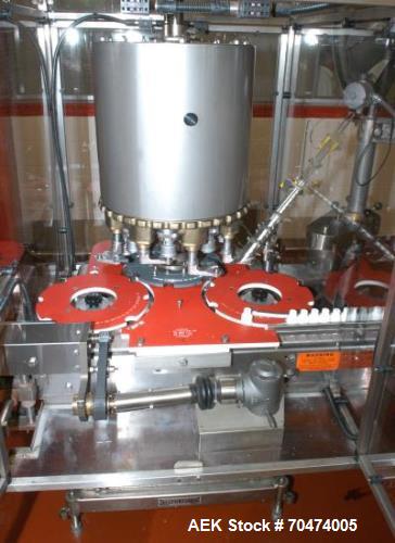 Used 2 oz. Energy Shot Bottle Filling Line. Includes: New England Model NEHCPCL bottle unscrambler with bottle elevator, capable of 250/minute. DTM Purefil 2000 12-head straightline continuous motion...