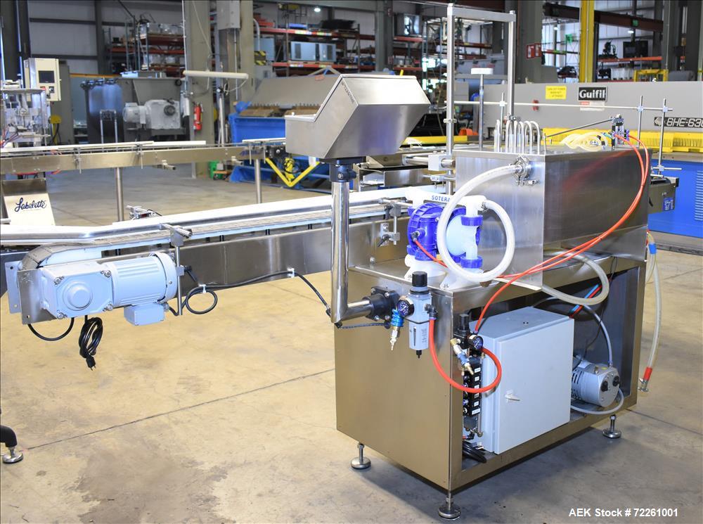 Used Accutek 6 Automatic Vacuum Liquid Filling Line for Glass Containers.