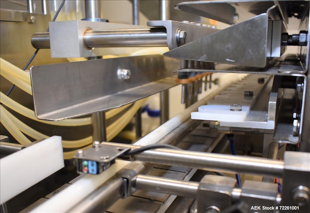 Used Accutek 6 Automatic Vacuum Liquid Filling Line for Glass Containers.