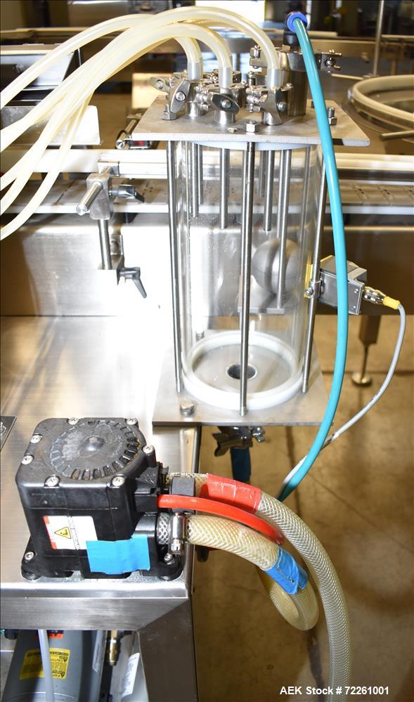 Used Accutek 6 Automatic Vacuum Liquid Filling Line for Glass Containers.