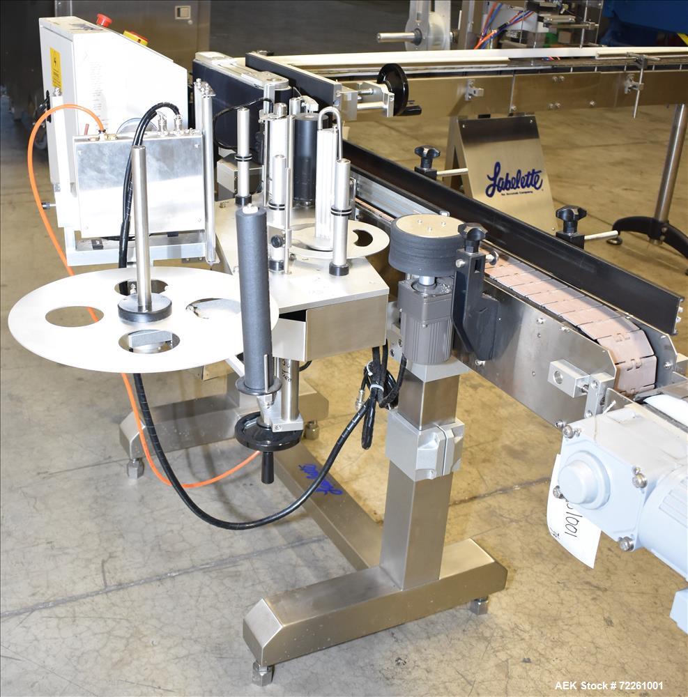 Used Accutek 6 Automatic Vacuum Liquid Filling Line for Glass Containers.
