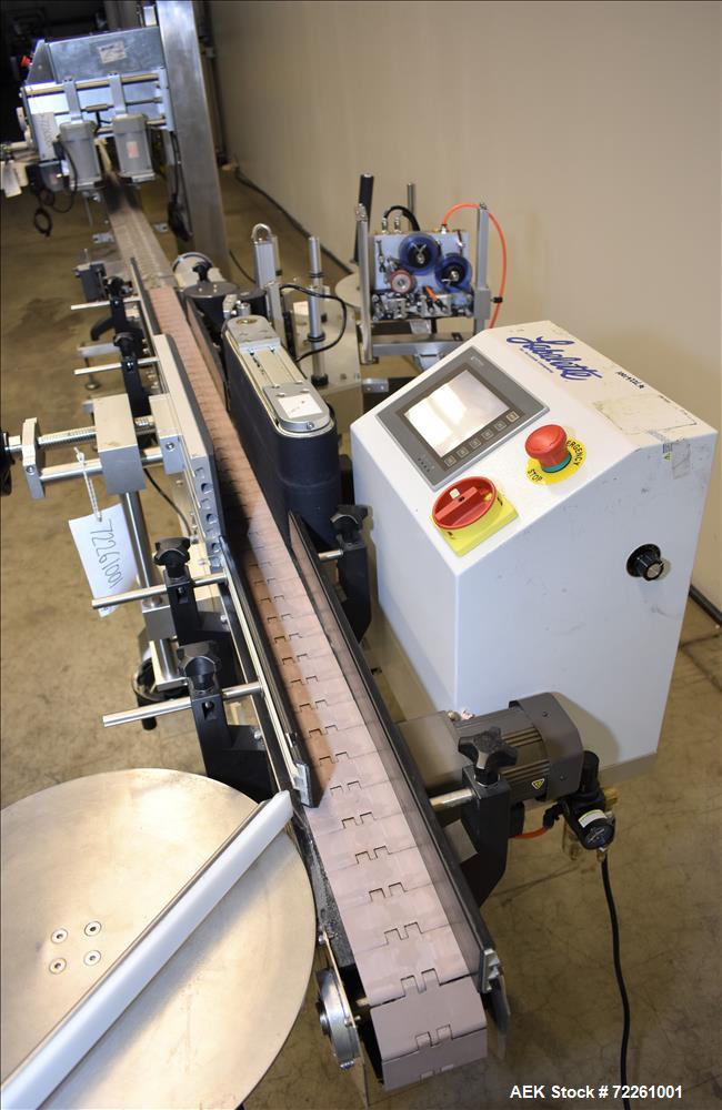 Used Accutek 6 Automatic Vacuum Liquid Filling Line for Glass Containers.