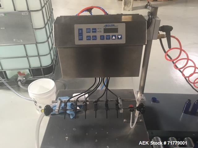 Used Accutek Table Top Filling System, semi-auto operation, consisting of; Mini-Pinch (Six Head) Timed Flow Volumetric Filler, with Adjustable Table Top Stand, Fill Wand, Individual Flow Control Adju...