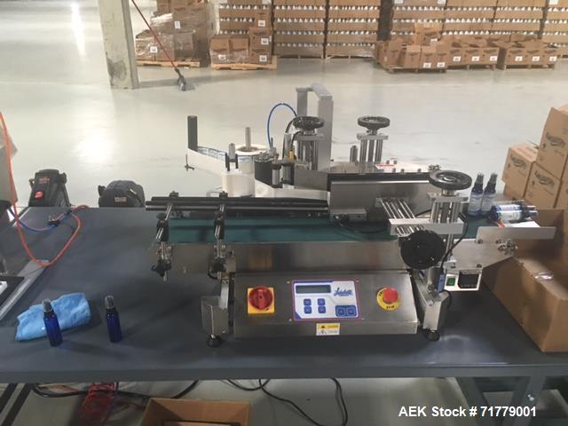 Used Accutek Table Top Filling System, semi-auto operation, consisting of; Mini-Pinch (Six Head) Timed Flow Volumetric Filler, with Adjustable Table Top Stand, Fill Wand, Individual Flow Control Adju...