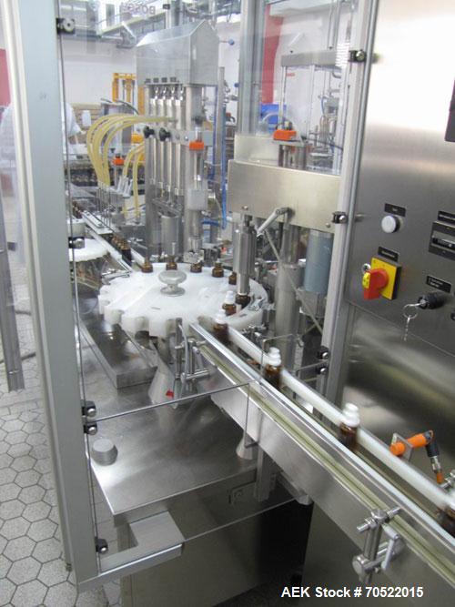 Used Bosch MRF 1010 Bottle Filling/Closing Machine. Filling range 0.1 - 8.5 fl oz (0.5 - 250 ml), output 3,000 bottles an hour. 4 Filling stations with rotary slide piston pumps, capper, torque-screw...