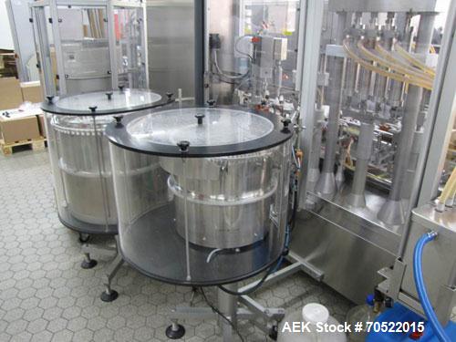 Used Bosch MRF 1010 Bottle Filling/Closing Machine. Filling range 0.1 - 8.5 fl oz (0.5 - 250 ml), output 3,000 bottles an hour. 4 Filling stations with rotary slide piston pumps, capper, torque-screw...