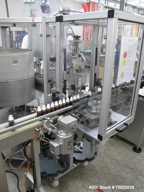 Used Bosch MRF 1010 Bottle Filling/Closing Machine. Filling range 0.1 - 8.5 fl oz (0.5 - 250 ml), output 3,000 bottles an hour. 4 Filling stations with rotary slide piston pumps, capper, torque-screw...
