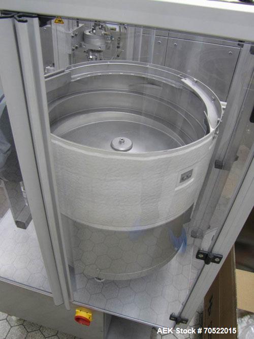 Used Bosch MRF 1010 Bottle Filling/Closing Machine. Filling range 0.1 - 8.5 fl oz (0.5 - 250 ml), output 3,000 bottles an hour. 4 Filling stations with rotary slide piston pumps, capper, torque-screw...