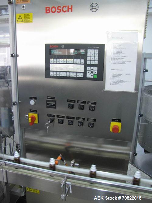 Used Bosch MRF 1010 Bottle Filling/Closing Machine. Filling range 0.1 - 8.5 fl oz (0.5 - 250 ml), output 3,000 bottles an hour. 4 Filling stations with rotary slide piston pumps, capper, torque-screw...