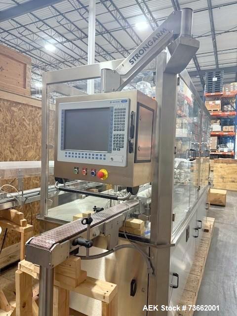 Used Capmatic Bottling Line, Model Verifill. Line consists of: (1) Capmatic Bottle Cleaner, (1) Capmatic rotary chuck capper, model Roadrunner 4HM, (1) LSI pressure sensitive wraparound labeler, mode...