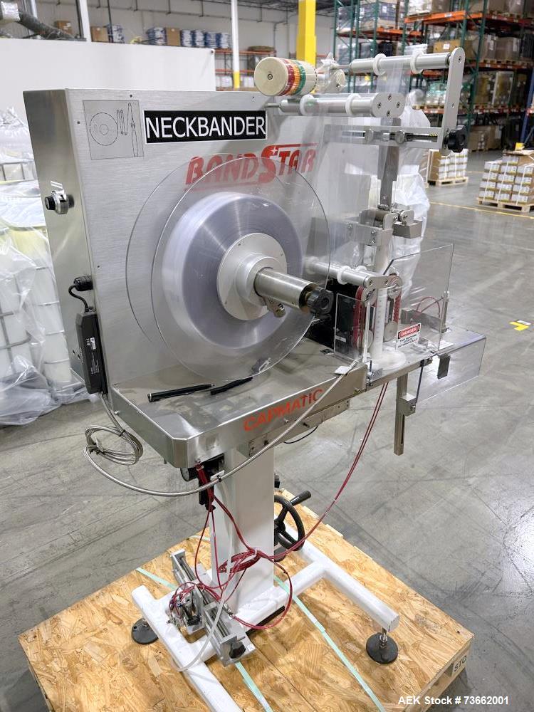 Used Capmatic Bottling Line, Model Verifill. Line consists of: (1) Capmatic Bottle Cleaner, (1) Capmatic rotary chuck capper, model Roadrunner 4HM, (1) LSI pressure sensitive wraparound labeler, mode...