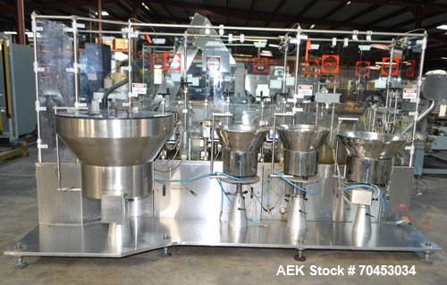 Used Capmatic Straight Line Automatic “Puck Style” Fragrance Line, Model Patriot L, S/N PA03101111, new 2004.  3/60/480V/20A.  6 Head Straight Line Vacuum Filler, Model Vacufill, S/N RV03101110, with...
