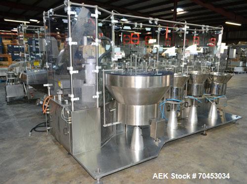 Used Capmatic Straight Line Automatic “Puck Style” Fragrance Line, Model Patriot L, S/N PA03101111, new 2004.  3/60/480V/20A.  6 Head Straight Line Vacuum Filler, Model Vacufill, S/N RV03101110, with...