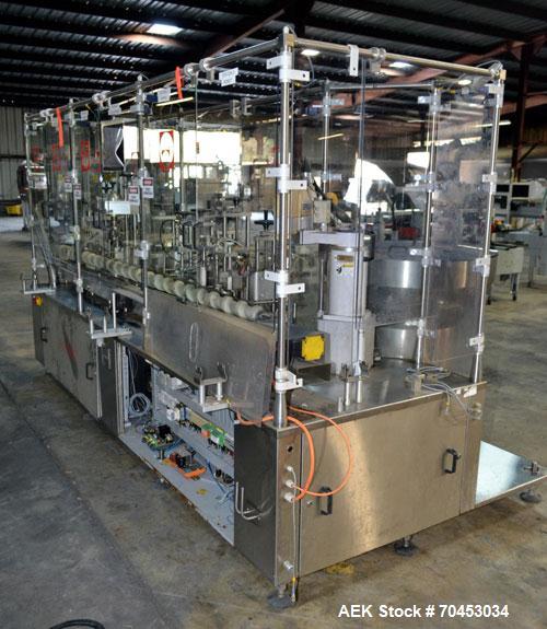 Used Capmatic Straight Line Automatic “Puck Style” Fragrance Line, Model Patriot L, S/N PA03101111, new 2004.  3/60/480V/20A.  6 Head Straight Line Vacuum Filler, Model Vacufill, S/N RV03101110, with...