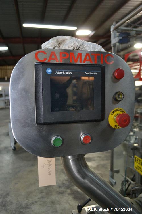 Used Capmatic Straight Line Automatic “Puck Style” Fragrance Line, Model Patriot L, S/N PA03101111, new 2004.  3/60/480V/20A.  6 Head Straight Line Vacuum Filler, Model Vacufill, S/N RV03101110, with...