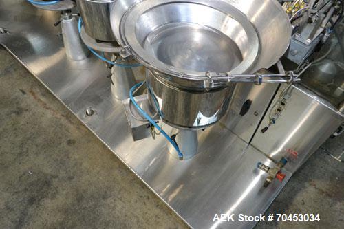 Used Capmatic Straight Line Automatic “Puck Style” Fragrance Line, Model Patriot L, S/N PA03101111, new 2004.  3/60/480V/20A.  6 Head Straight Line Vacuum Filler, Model Vacufill, S/N RV03101110, with...