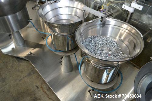 Used Capmatic Straight Line Automatic “Puck Style” Fragrance Line, Model Patriot L, S/N PA03101111, new 2004.  3/60/480V/20A.  6 Head Straight Line Vacuum Filler, Model Vacufill, S/N RV03101110, with...