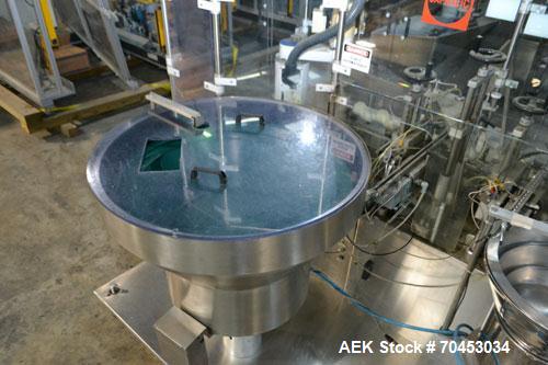 Used Capmatic Straight Line Automatic “Puck Style” Fragrance Line, Model Patriot L, S/N PA03101111, new 2004.  3/60/480V/20A.  6 Head Straight Line Vacuum Filler, Model Vacufill, S/N RV03101110, with...