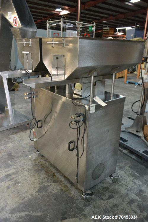 Used Capmatic Straight Line Automatic “Puck Style” Fragrance Line, Model Patriot L, S/N PA03101111, new 2004.  3/60/480V/20A.  6 Head Straight Line Vacuum Filler, Model Vacufill, S/N RV03101110, with...