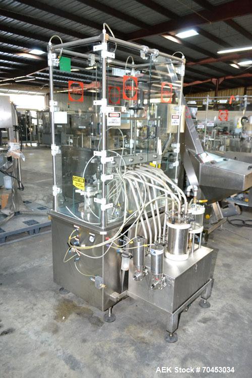 Used Capmatic Straight Line Automatic “Puck Style” Fragrance Line, Model Patriot L, S/N PA03101111, new 2004.  3/60/480V/20A.  6 Head Straight Line Vacuum Filler, Model Vacufill, S/N RV03101110, with...