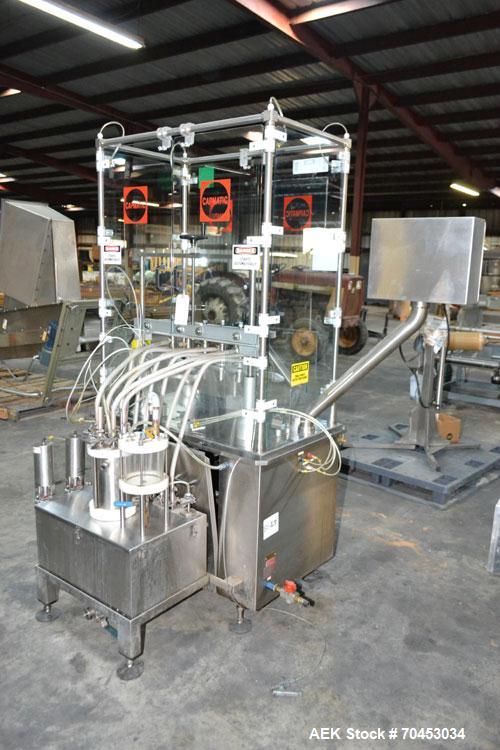Used Capmatic Straight Line Automatic “Puck Style” Fragrance Line, Model Patriot L, S/N PA03101111, new 2004.  3/60/480V/20A.  6 Head Straight Line Vacuum Filler, Model Vacufill, S/N RV03101110, with...