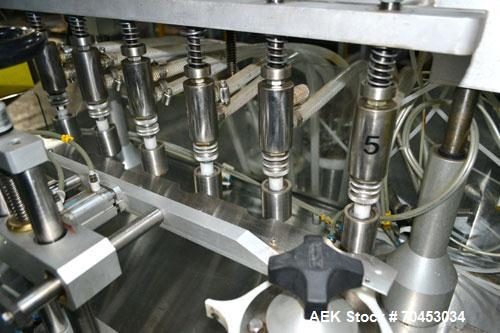 Used Capmatic Straight Line Automatic “Puck Style” Fragrance Line, Model Patriot L, S/N PA03101111, new 2004.  3/60/480V/20A.  6 Head Straight Line Vacuum Filler, Model Vacufill, S/N RV03101110, with...