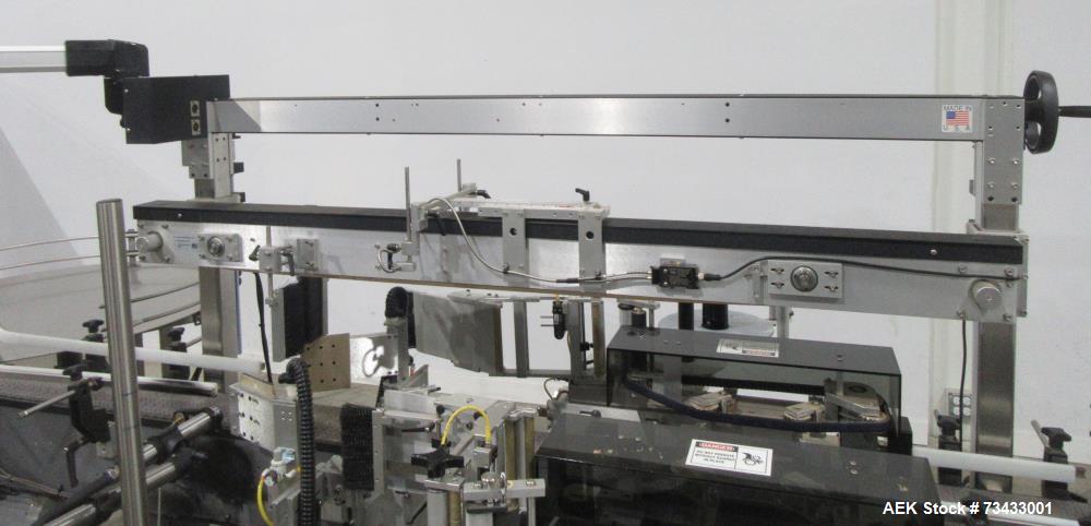 Complete Inline Bottle Filling and Packaging Line – Overflow Filler, Capper & Labeler
