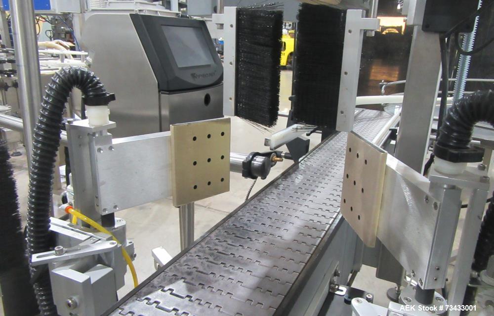 Complete Inline Bottle Filling and Packaging Line – Overflow Filler, Capper & Labeler