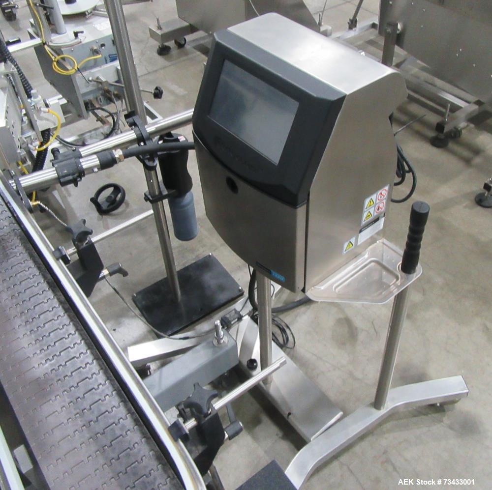 Complete Inline Bottle Filling and Packaging Line – Overflow Filler, Capper & Labeler