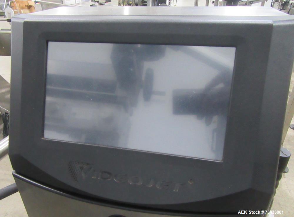 Complete Inline Bottle Filling and Packaging Line – Overflow Filler, Capper & Labeler