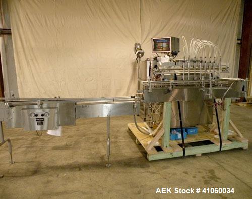 Used Kalish Liquid Bottle Filling Lineconsisting of: (1) Kalishtronic 8 head inline bottom up filler, Model KT12. (8) 5/8’’ diameter x 8-7/8’’ long diving nozzles, set up for approximately 946 ml. (8...