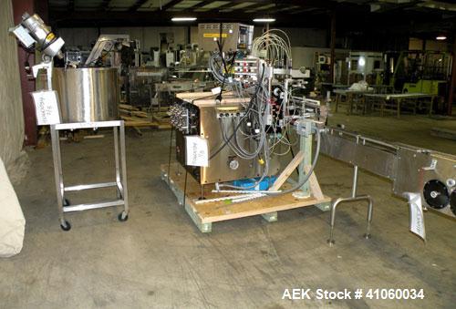 Used Kalish Liquid Bottle Filling Lineconsisting of: (1) Kalishtronic 8 head inline bottom up filler, Model KT12. (8) 5/8’’ diameter x 8-7/8’’ long diving nozzles, set up for approximately 946 ml. (8...