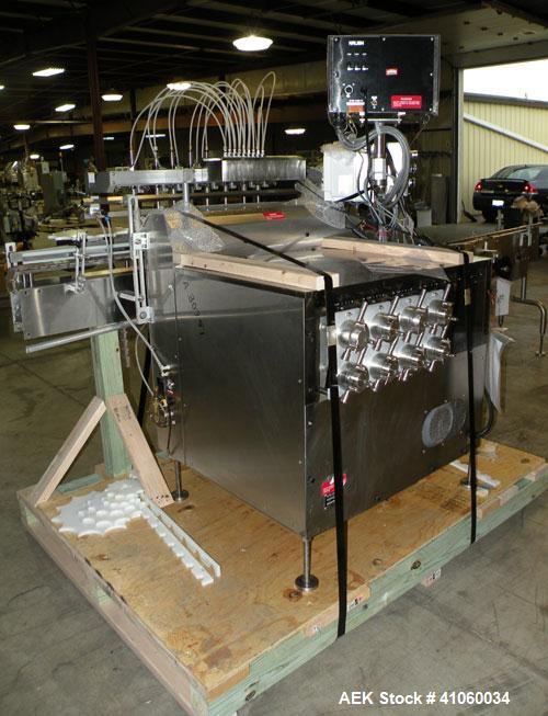 Used Kalish Liquid Bottle Filling Lineconsisting of: (1) Kalishtronic 8 head inline bottom up filler, Model KT12. (8) 5/8’’ diameter x 8-7/8’’ long diving nozzles, set up for approximately 946 ml. (8...