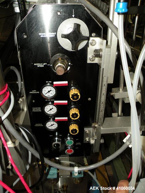 Used Kalish Liquid Bottle Filling Lineconsisting of: (1) Kalishtronic 8 head inline bottom up filler, Model KT12. (8) 5/8’’ diameter x 8-7/8’’ long diving nozzles, set up for approximately 946 ml. (8...