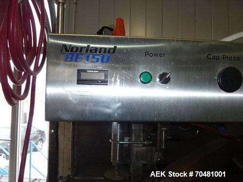 Used Norland 5 Gallon Bottle Water Filling Line capable of filling up to 150 bottles per hour.  Norland BW150 bottle washer, compact design, stainless steel construction, recirculated wash and saniti...