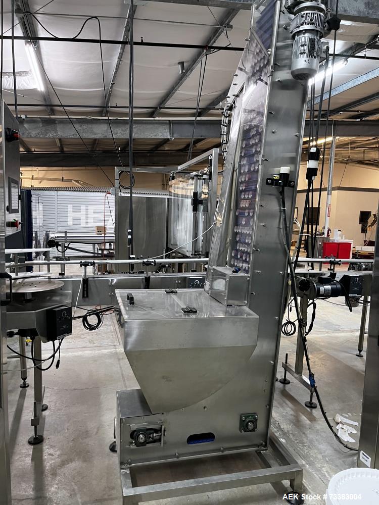 Used Complete Filling line for Bottle, manufactured by Norland. Running 25oz Bottles