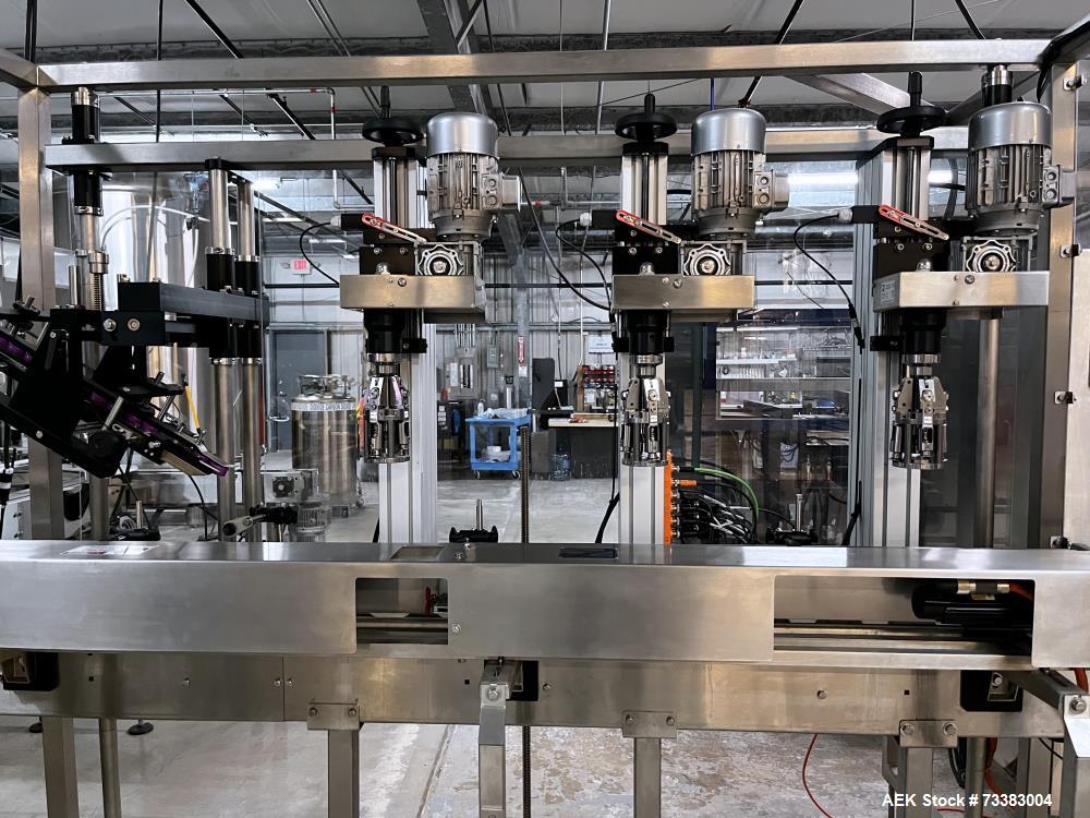 Used Complete Filling line for Bottle, manufactured by Norland. Running 25oz Bottles