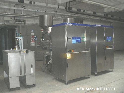 Used Tetra Pak Tetra Top TT3 Filling Machine.  Maximum capacity 9,000 units per hour, 3/50 hz/400V, filling volumes 0.13, 0.19 or 0.26 gallons (500, 750, 1000 ml), (2) Tetra cappers, CE certified.