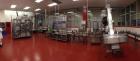 Used 2 oz. Energy Shot Bottle Filling Line. Includes: New England Model NEHCPCL bottle unscrambler with bottle elevator, capable of 250/minute. DTM Purefil 2000 12-head straightline continuous motion...