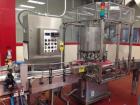 Used 2 oz. Energy Shot Bottle Filling Line. Includes: New England Model NEHCPCL bottle unscrambler with bottle elevator, capable of 250/minute. DTM Purefil 2000 12-head straightline continuous motion...