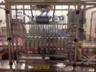 Used 2 oz. Energy Shot Bottle Filling Line. Includes: New England Model NEHCPCL bottle unscrambler with bottle elevator, capable of 250/minute. DTM Purefil 2000 12-head straightline continuous motion...